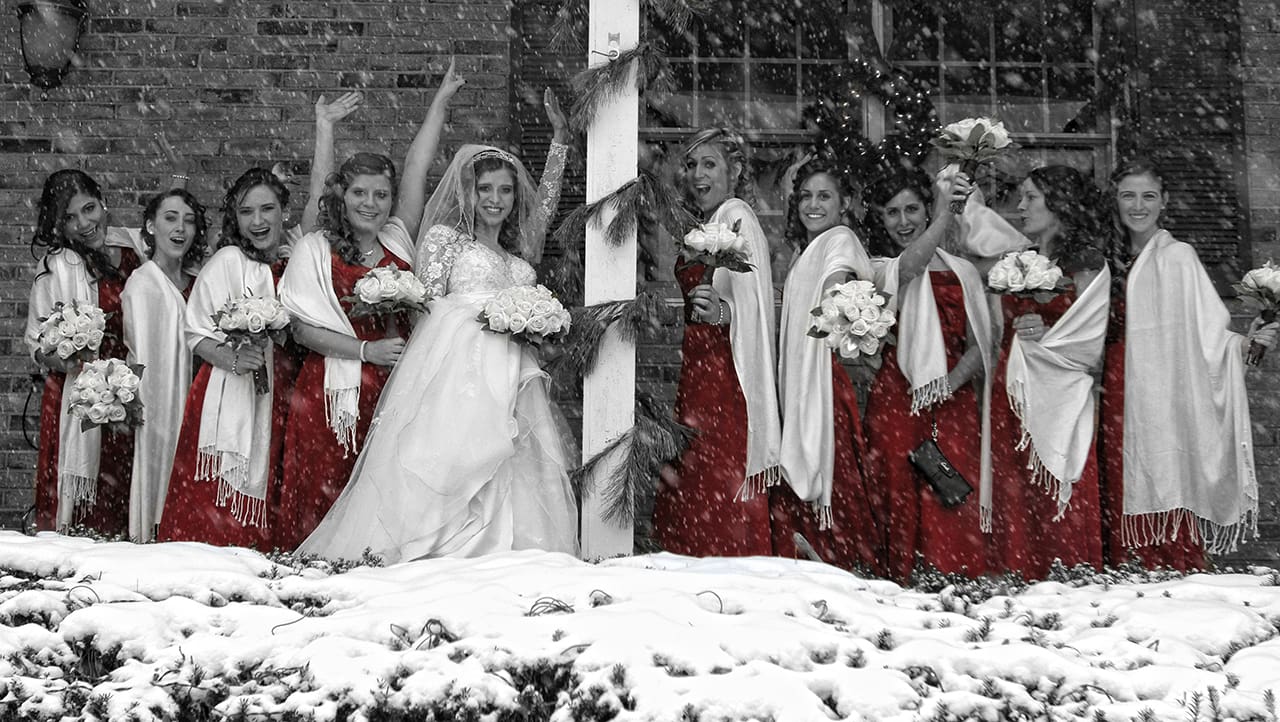 A group of women in red and white dresses.